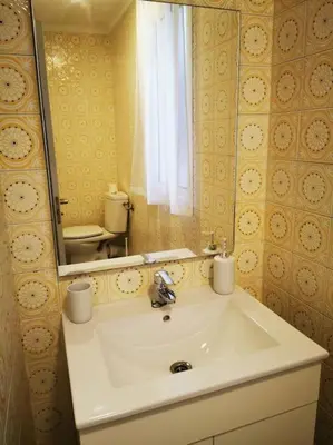 a bathroom with a sink and a mirror at Great 4 bedrooms apartament in Puerto de Sagunto - Full Apartment - 120m2 in Puerto de Sagunto