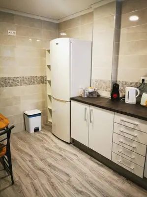a kitchen with a white refrigerator in a room at Great 4 bedrooms apartament in Puerto de Sagunto - Full Apartment - 120m2 in Puerto de Sagunto