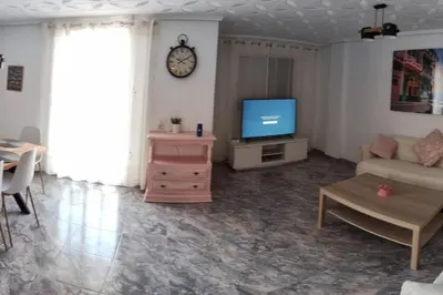 a living room with a couch and a tv at Great 4 bedrooms apartament in Puerto de Sagunto - Full Apartment - 120m2 in Puerto de Sagunto