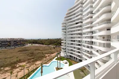 a view of the pool from the balcony of a apartment at Global Vacacional, Moderno apartamento con 2 terrazas y 3 habitaciones in Canet de Berenguer