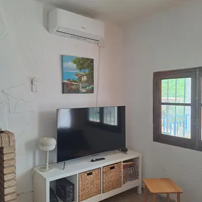a living room with a large flat screen tv at Buganvilla in Valencia