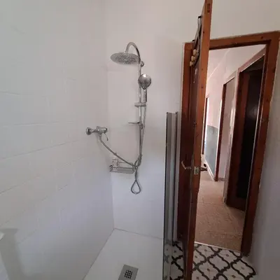 a shower in a bathroom with a glass door at Buganvilla in Valencia