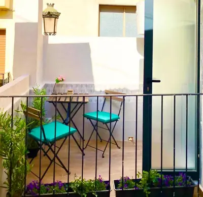 a balcony with a table and two chairs at Sagunto Castillo 17 in Sagunto
