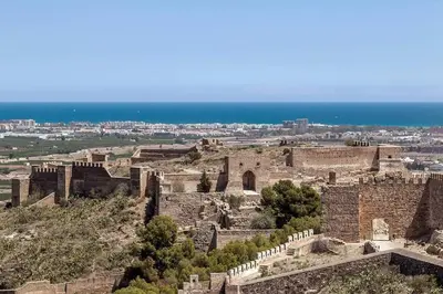 a view of a castle with the ocean in the background at Sagunto Castillo 17 in Sagunto