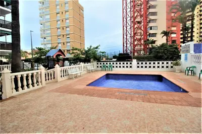 a swimming pool in the middle of a city at Sun & Sea Puebla in Puebla de Farnals