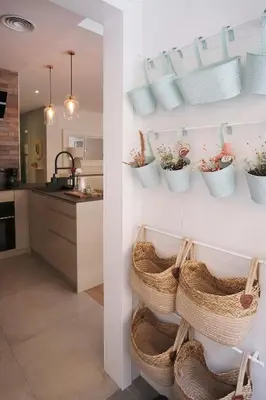 a kitchen with wicker baskets on the wall at Lujoso Hogar cerca del Casco Antiguo de la ciudad in Valencia