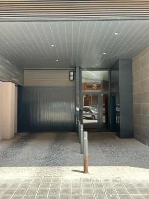 an entrance to a building with a parking garage at Lujoso Hogar cerca del Casco Antiguo de la ciudad in Valencia