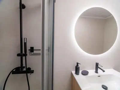a bathroom with a sink and a mirror at MD Iturbi Jardin Turia in Valencia