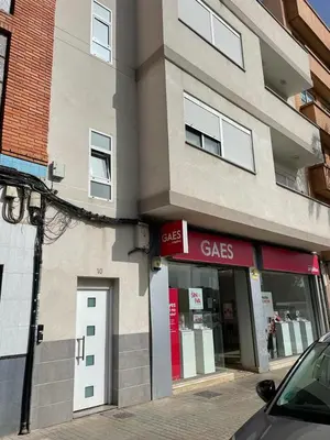 a store front of a building on a street at UIM Mediterraneo ATICO Hipanidad 1 WIFI in Puerto de Sagunto