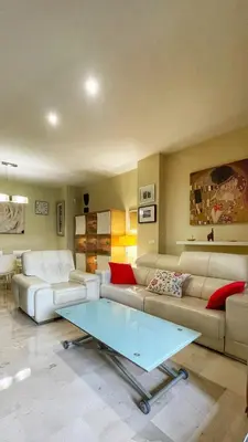 a living room with a couch and a coffee table at Work and Rest Away From Home in Paterna