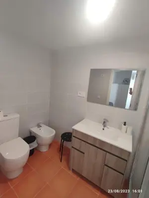 a white bathroom with a toilet and a sink at Arts & Sciences Rooms - Valencia Authentic Urban Parklife - VLC Urban Rental in Valencia