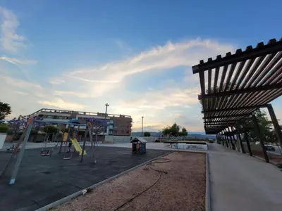 a park with a playground and a building at Apartamento Margalló con Garaje in Xilxes