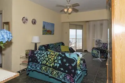 a living room with a couch and a ceiling fan at El Raco, A-8-16 in Cullera