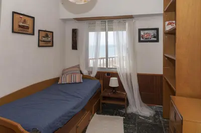 a small bedroom with a bed and a window at El Raco, A-8-16 in Cullera