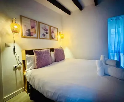 a bedroom with a bed with a teddy bear on it at Design & Stylish House in the CENTER of Valencia in Valencia