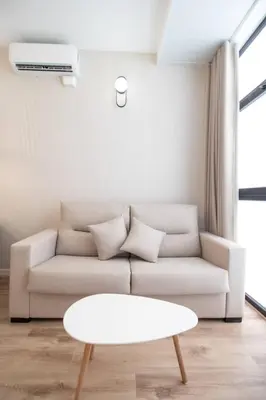 a living room with a couch and a table at Maritim 1 by Concept Flats in Valencia