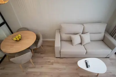 a living room with a white couch and a table at Maritim 1 by Concept Flats in Valencia