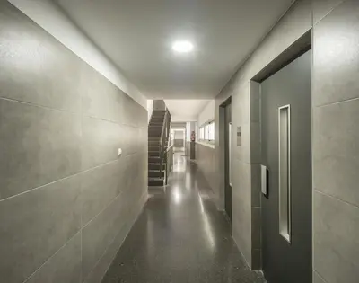 a hallway with a staircase in a building at Macflats Ciudad de las Ciencias in Valencia