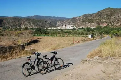 two bikes parked on the side of a road at VILLA TAMARIT in Pedralba