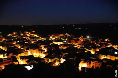 a view of a city at night with lights at VILLA TAMARIT in Pedralba