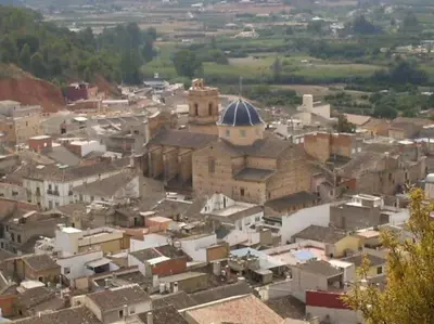 an aerial view of a village with a church at VILLA TAMARIT in Pedralba