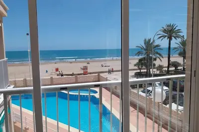 a view of the beach from the balcony of a condo at Santa Marta frente al mar in Cullera