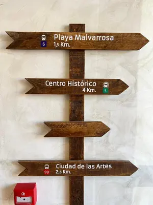 a group of wooden signs on a wall at Lumen Mare by SH Hoteles in Valencia