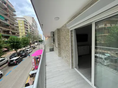 an apartment balcony with a view of a street at Apartamento de lujo en Cullera con Aire Acondicionado in Cullera