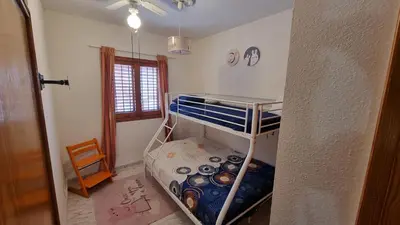 a small room with a bunk bed in it at Bali Beach Puzol relax en la playa cerca de Sagunto y Valencia in Puzol