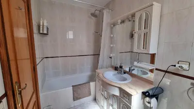 a bathroom with a sink and a bath tub at Bali Beach Puzol relax en la playa cerca de Sagunto y Valencia in Puzol