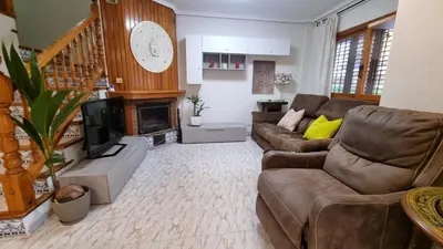 a living room with a couch and a fireplace at Bali Beach Puzol relax en la playa cerca de Sagunto y Valencia in Puzol