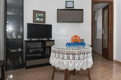 a living room with a table and a tv at GALEON, 10-75 Atico in Cullera