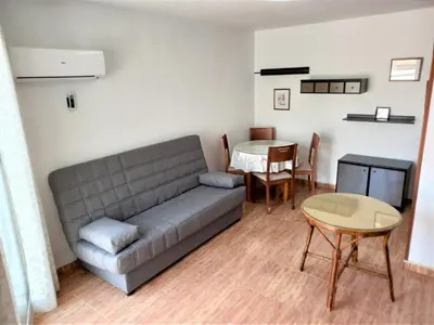 a living room with a couch and a table at GALEON, 10-75 Atico in Cullera