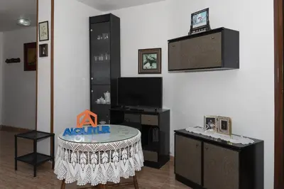 a living room with a table and a tv at GALEON, 10-75 Atico in Cullera