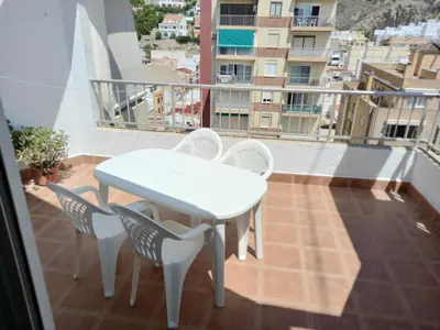 a white table and chairs on a balcony at GALEON, 10-75 Atico in Cullera