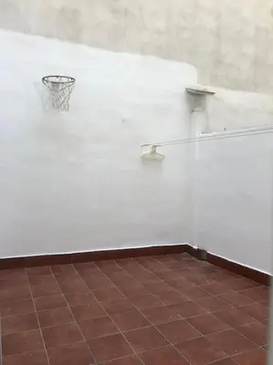 a white wall with a basketball hoop on it at Precioso apartamento reformado con terraza, 4 habs in Valencia