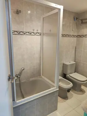 a bathroom with a tub and a toilet and a shower at Mar i piscina Canet playa in Canet de Berenguer