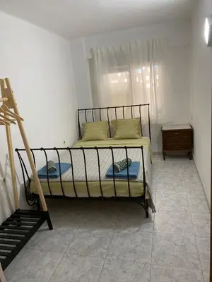 a bedroom with a bunk bed with a window at Beautiful apartment 1 minute walk to the beach in Puerto de Sagunto