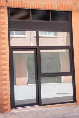 a window in a brick building with black trim at Maritim 2 by Concept Flats in Valencia
