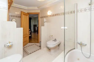 a bathroom with a toilet and a glass shower at GuestReady - A un paso del Mediterráneo in El Puig