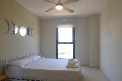 a living room with a couch and a table at Precioso apartamento en Canet Playa by Hometels in Canet de Berenguer