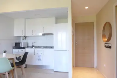 a bathroom with a shower and a toilet and a sink at Precioso apartamento en Canet Playa by Hometels in Canet de Berenguer
