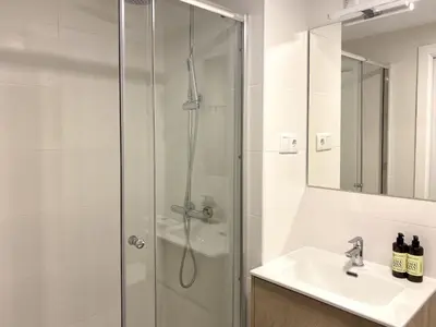 a bathroom with a shower and a sink at Habitación en Playa Malvarrosa con baño privado -No AC- in Valencia