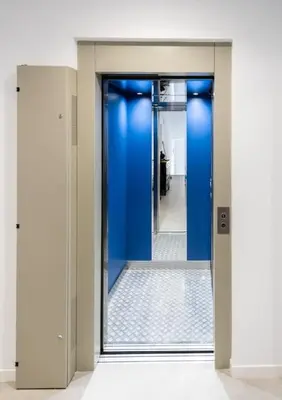 an open door to a hallway with blue walls at Habitación en Playa Malvarrosa con baño privado -No AC- in Valencia