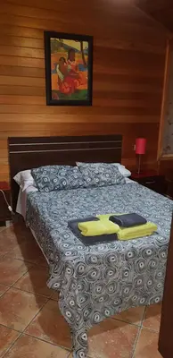 a bedroom with a bed with a towel on it at LA TRAMUNTANA CULLERA Playa Marenyet a 300 metros in Valencia