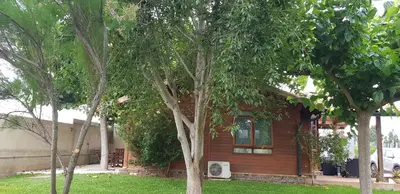 a house with trees in front of it at LA TRAMUNTANA CULLERA Playa Marenyet a 300 metros in Valencia