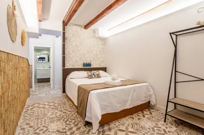 a bedroom with a bed in a room at LOFT RUZAFA PLUS in Valencia