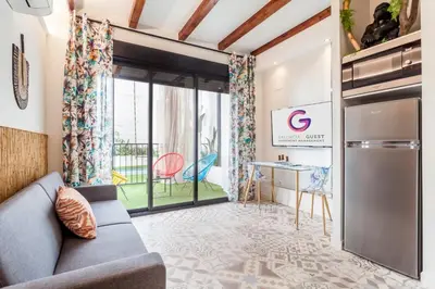 a living room with a couch and a table at LOFT RUZAFA PLUS in Valencia