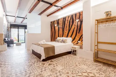 a bedroom with a bed and a large window at LOFT RUZAFA PLUS in Valencia