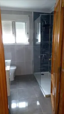 a bathroom with a shower and a toilet at Casa Tena in Partida de La Cañada